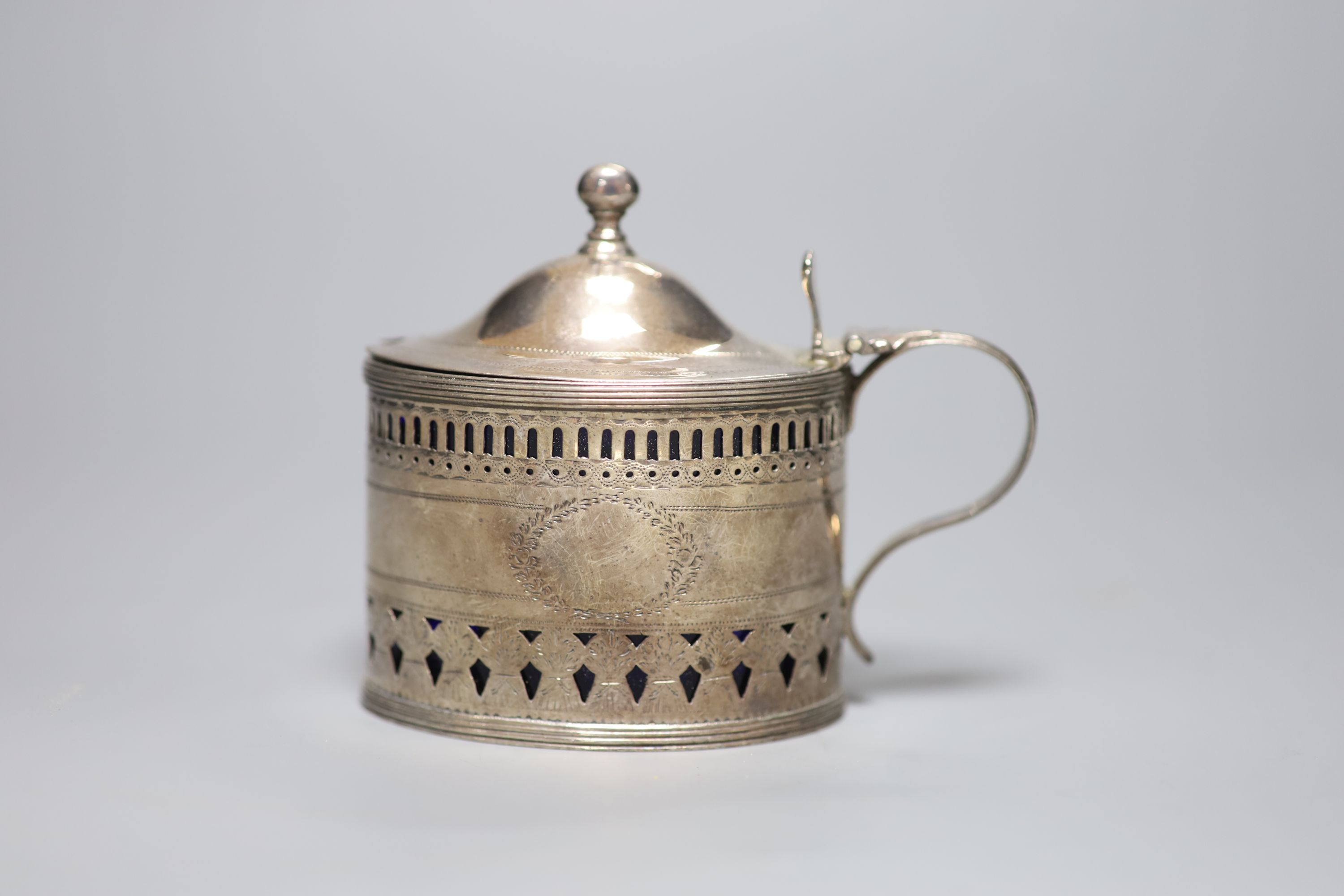 A George III pierced silver oval mustard, engraved with cockerel crest, Crispin Fuller, London, 1796